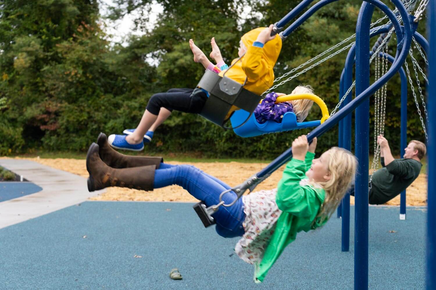 Kids swinging on playground at BlueCross Healthy Place in Farragut, TN