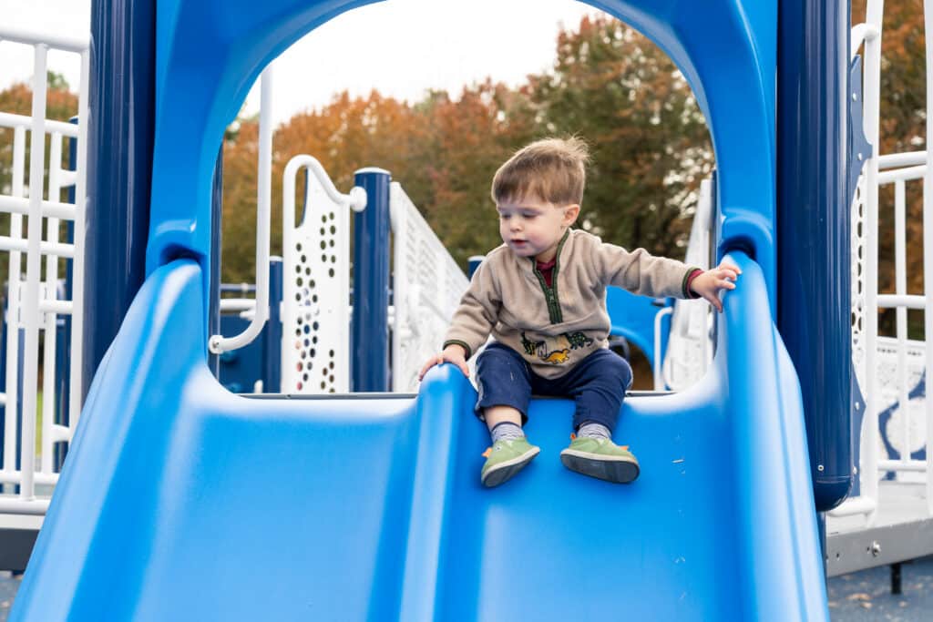 kid on slide at playground Blue Cross at Town Hall in Farragut