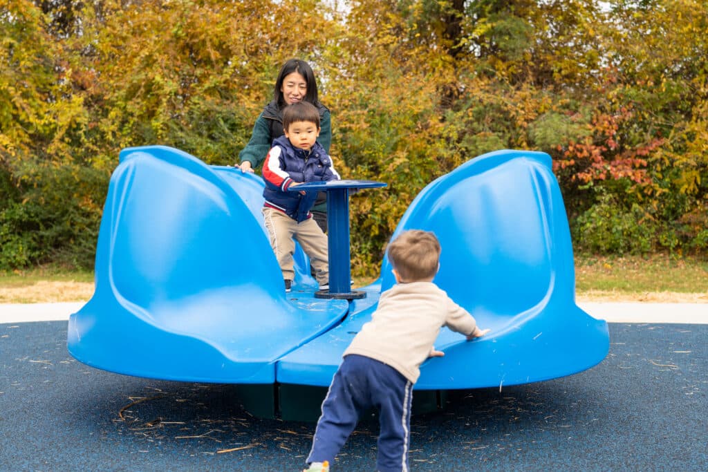 BlueCrossHealthyPlacePlaygroundMomandChild, fall trees