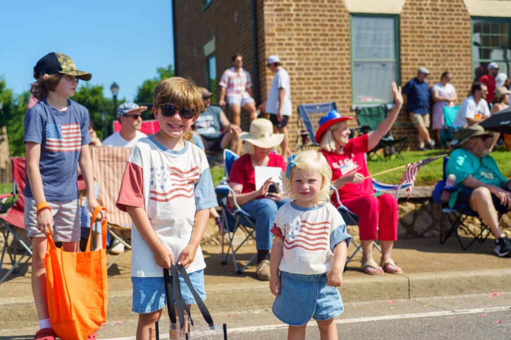 two Kids smiling Fourth of July Parade