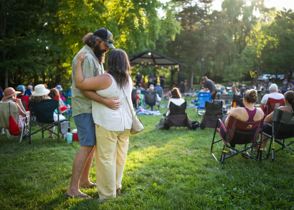Couple dancing to live music at the concert series in Founder's Park in Farragut