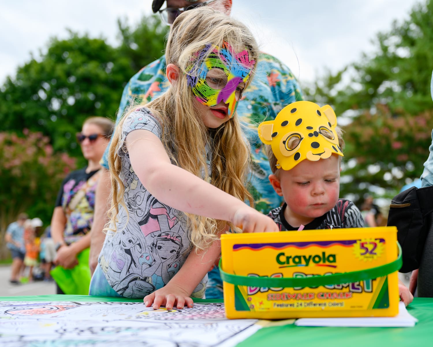 Kids in masks drawing at Art Fest in Farragut