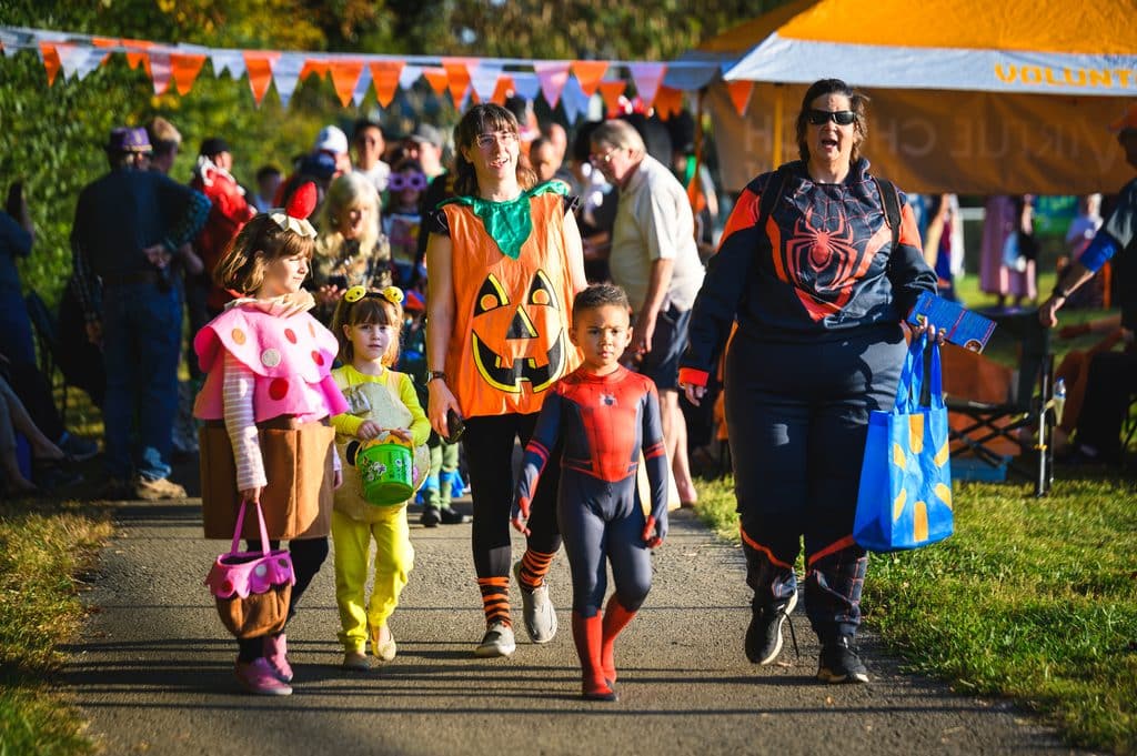 Family in Halloween costumes walking around Freak Friday in Farragut