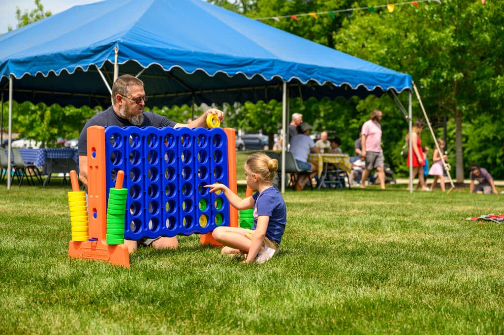 Family Playing lawn games at McGill Plaza Bluegrass Concert
