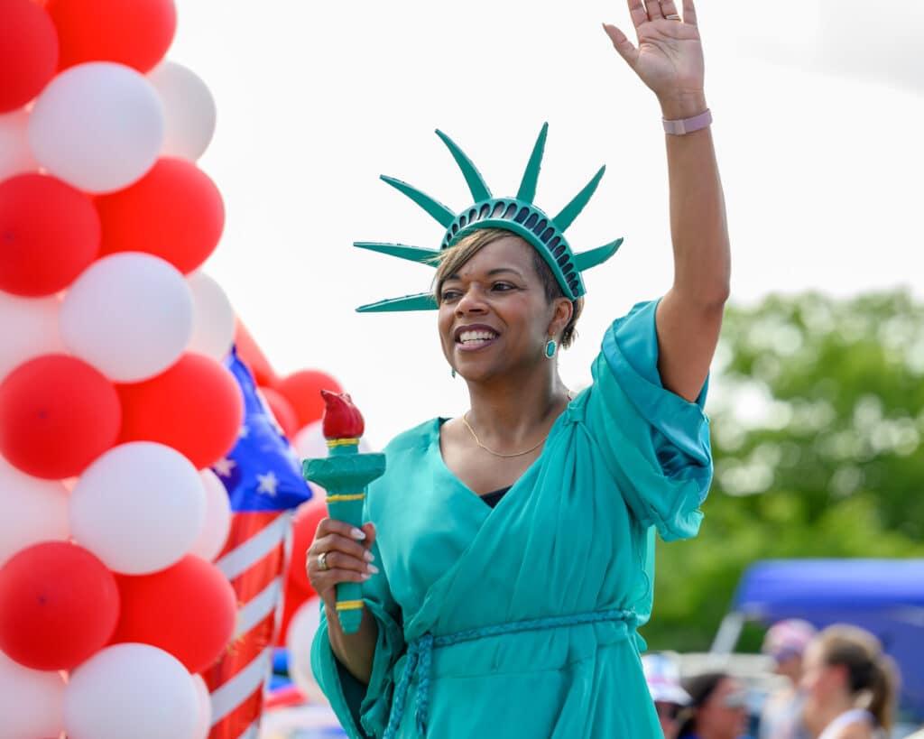 woman dressed for Fourth of July Parade Statue of Liberty