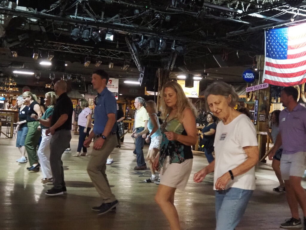 People line dancing at Cotton Eyed Joe