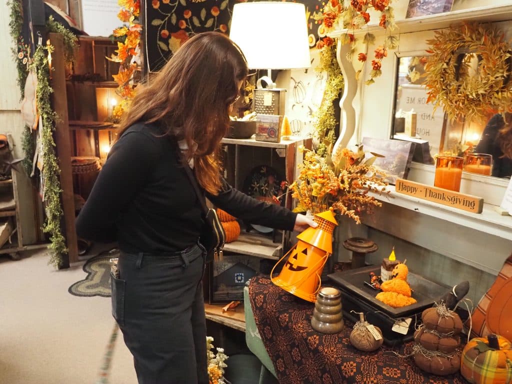 girl looking at fall decorations shopping at Homespun in Farragut