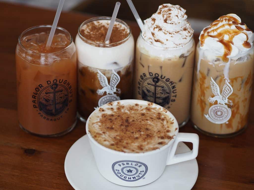 Parlor Doughnuts Coffee options iced and hot with whipped cream and caramel drizzle