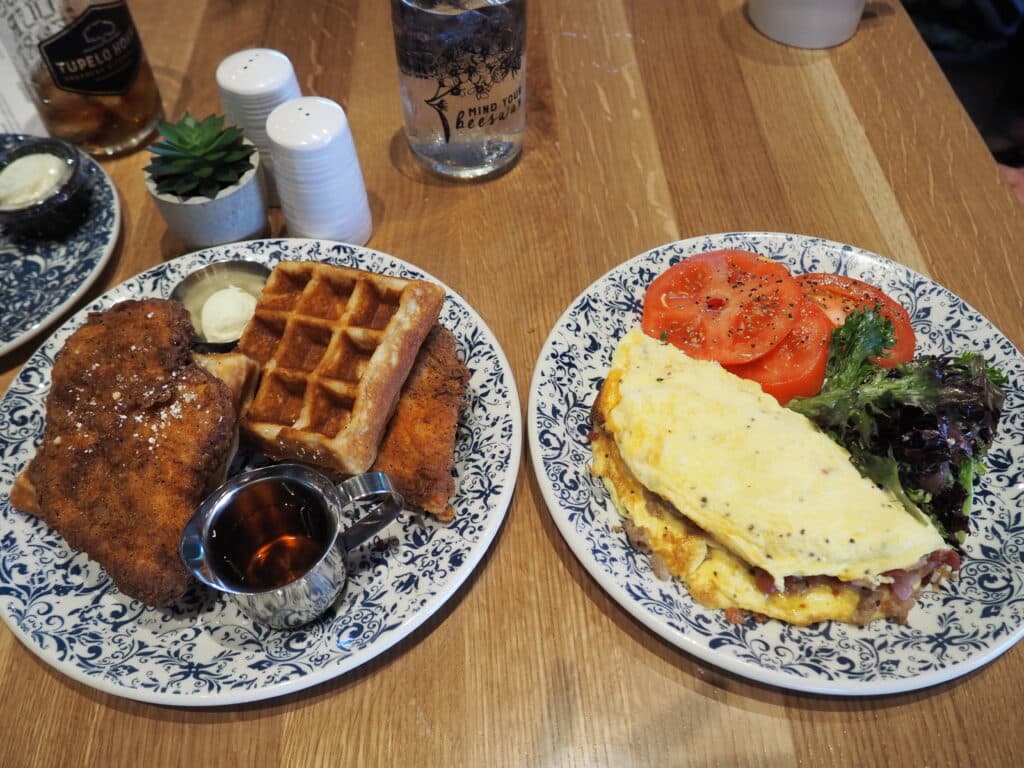 Tupelo Honey Brunch Breakfast, chicken and waffles, and omelette