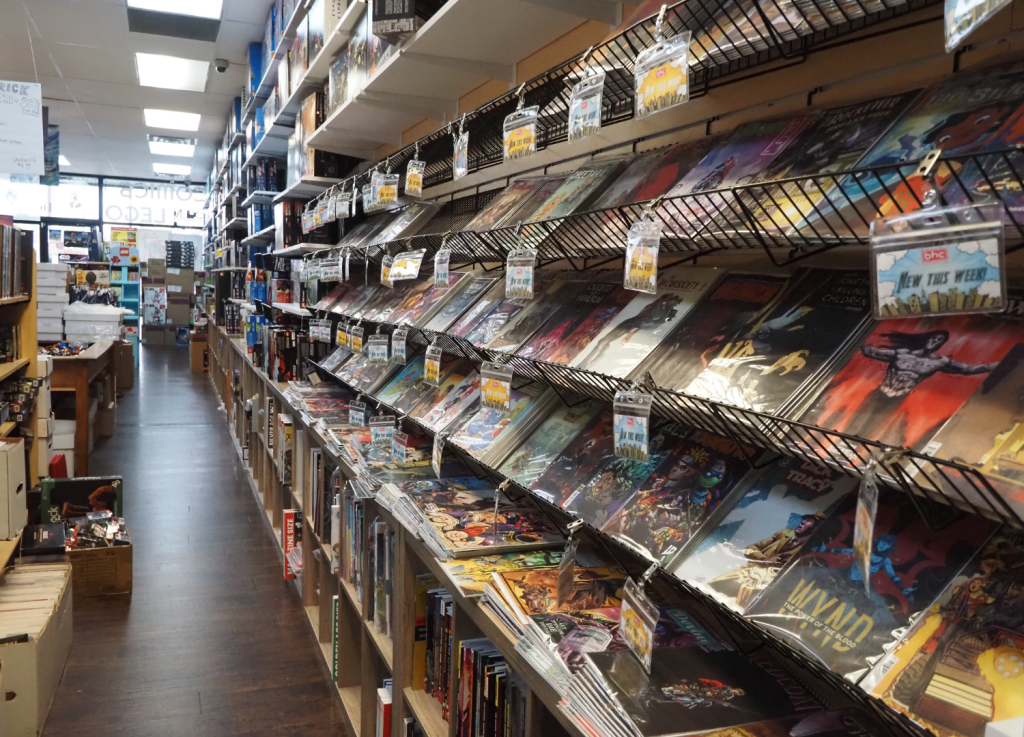 comic book rack and game boxes at Brickhouse collectibles