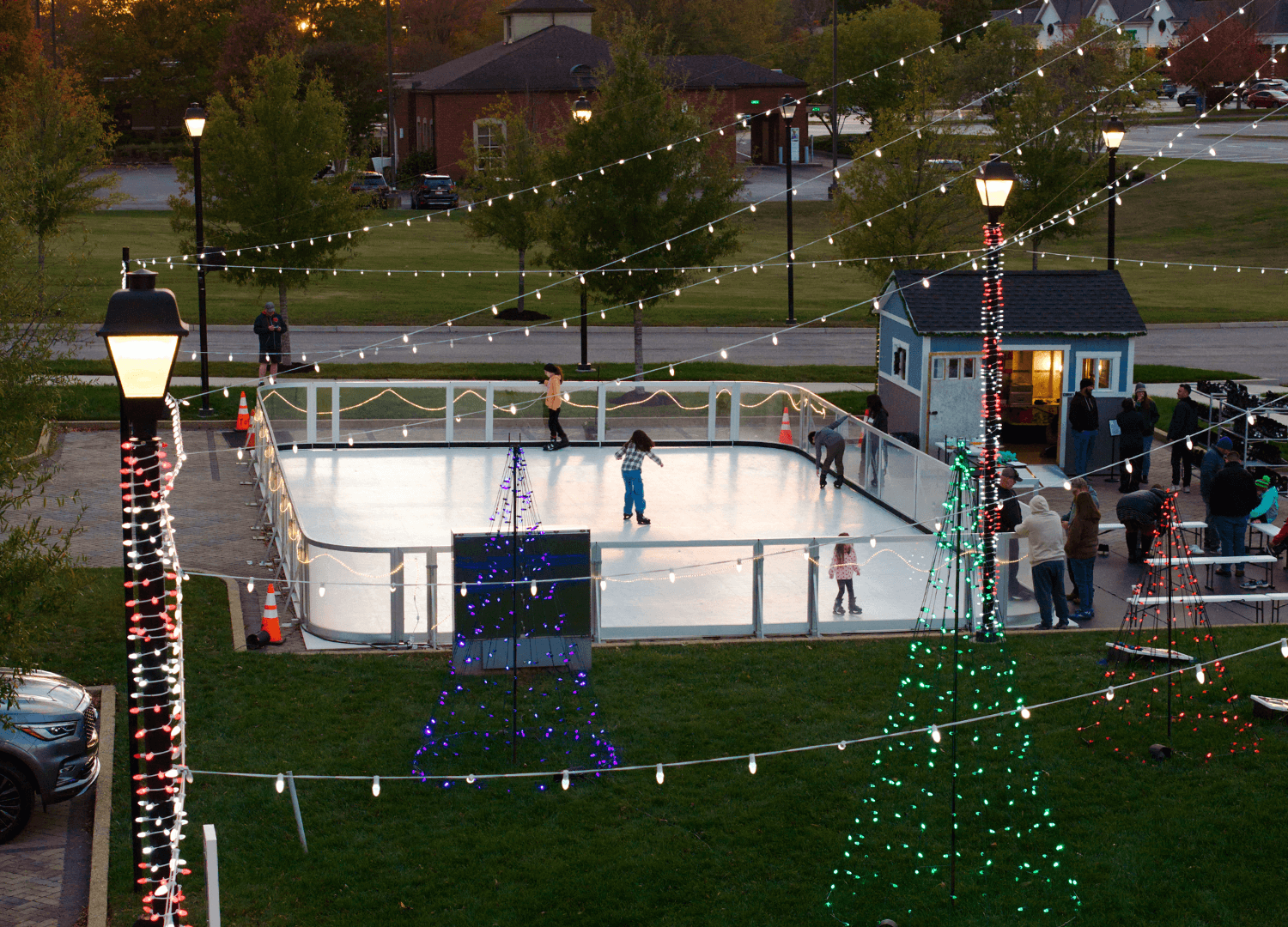 people skating on the ice rink at McGill Plaza
