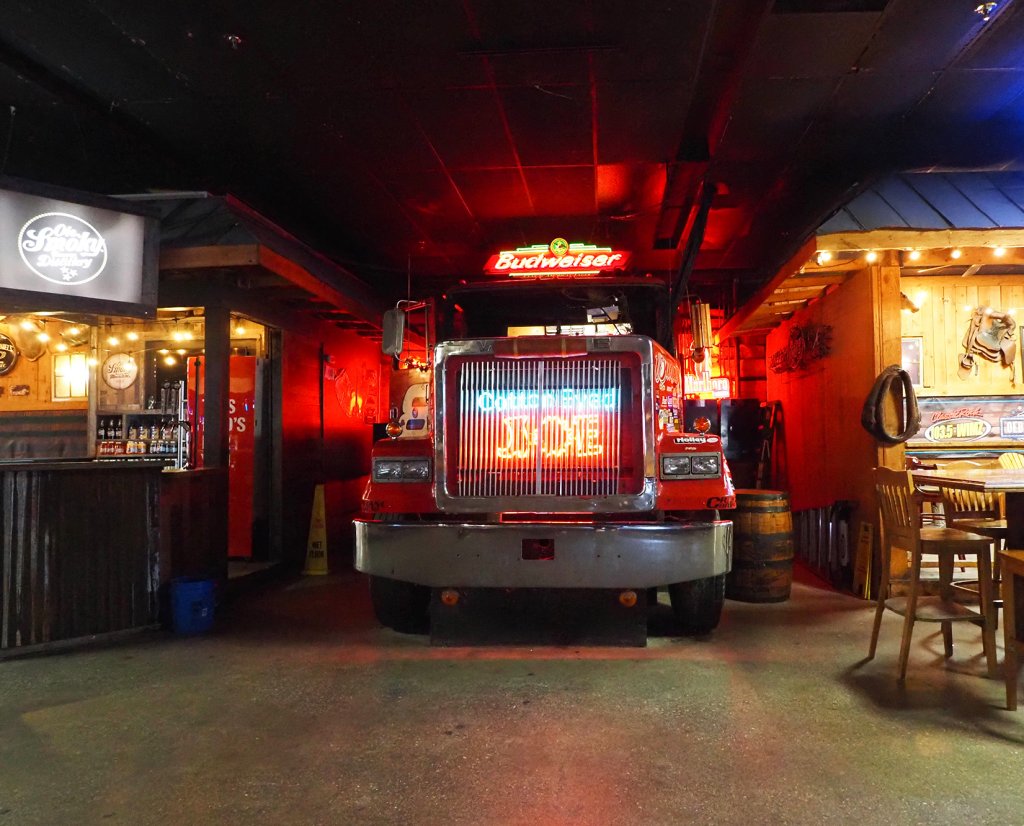 a neon-lit semi truck cab at Cotton Eyed Joe