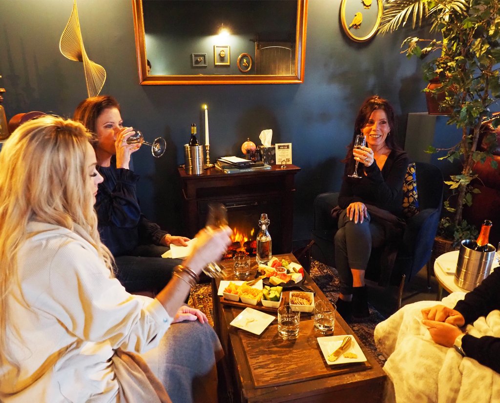 women enjoying wine and charcuterie at Sparrow Wine Bar